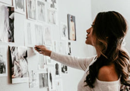 woman reading articles on wall